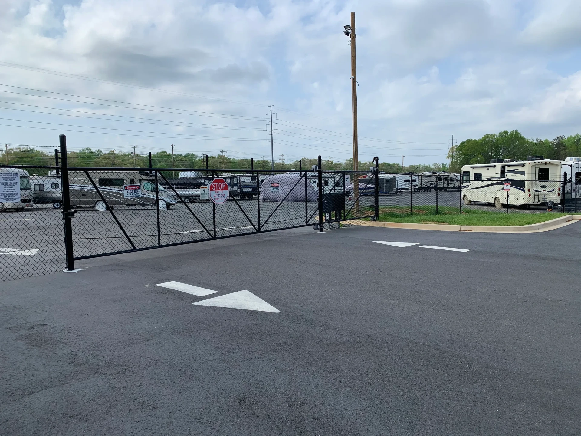 Automatic security gate at the entrance to the fenced RV storage lot