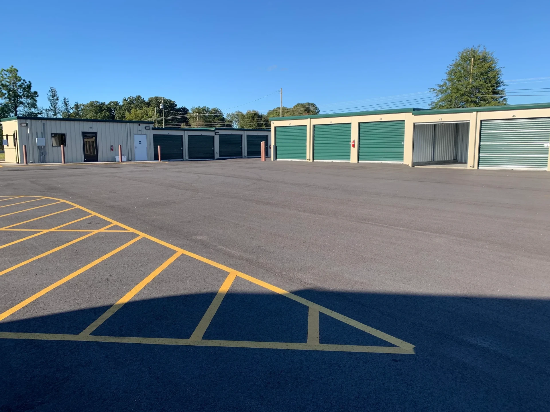 Rows of drive-up self storage units with paved access lanes